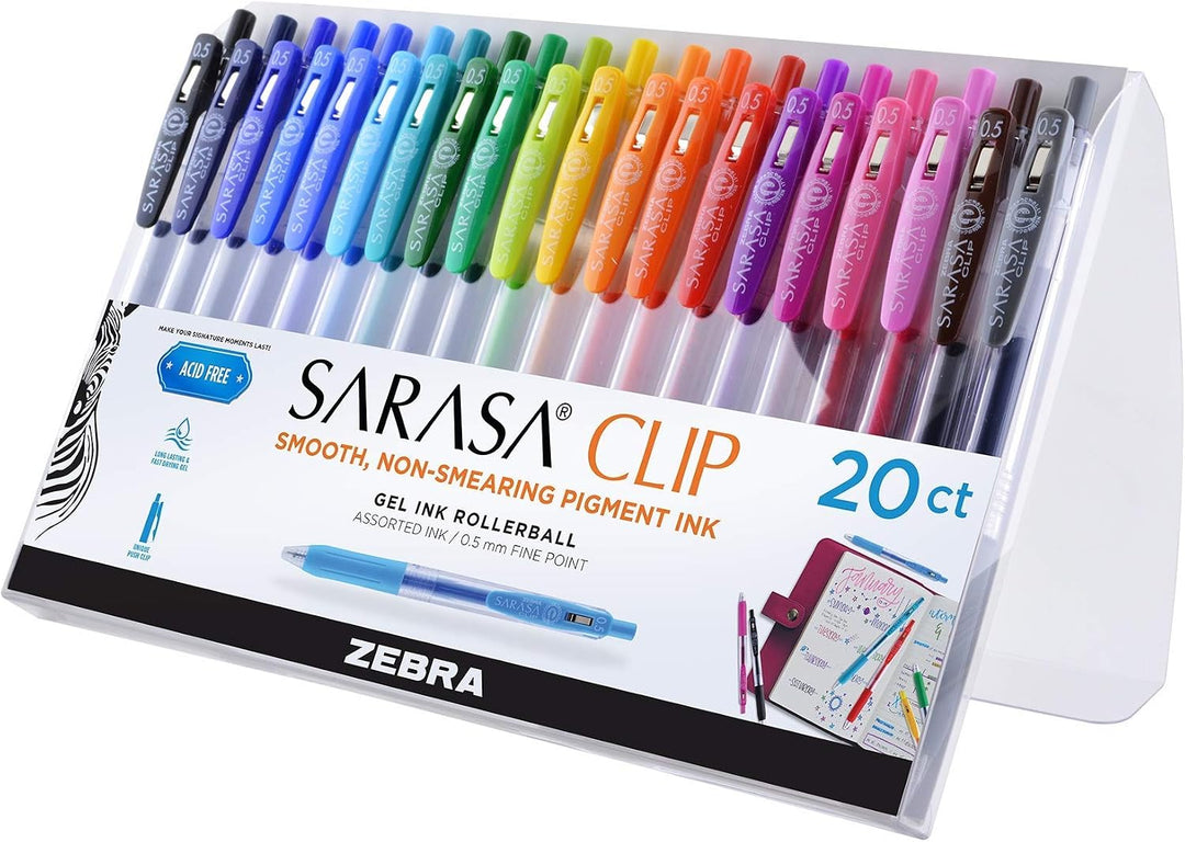 A 20-count set of Zebra Sarasa Clip gel ink rollerball pens in a clear plastic tray with a white and black cardboard backing. The pens are arranged in a rainbow gradient from blue and green on the left to pink, purple, orange, yellow, and brown on the right.
Zebra Sarasa Clip pastel gel pens and pink gold-heart pencils—cute, practical back-to-school teacher gifts.