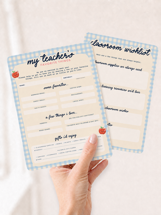 Two printed teacher cards with blue gingham borders are held in a person&