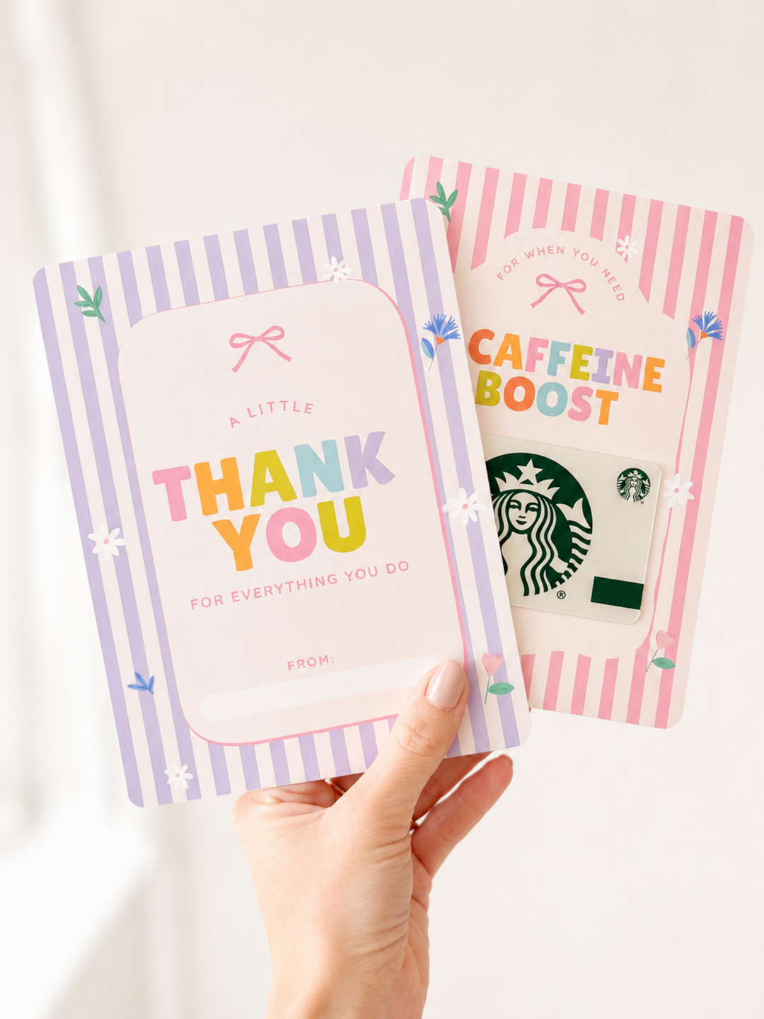 Two Starbucks-themed cards, one with 'Thank You' and the other with 'Caffeine Boost', held by a hand against a light background.
Pastel teacher appreciation gift card holders for a thank-you note or Starbucks coffee gift card.