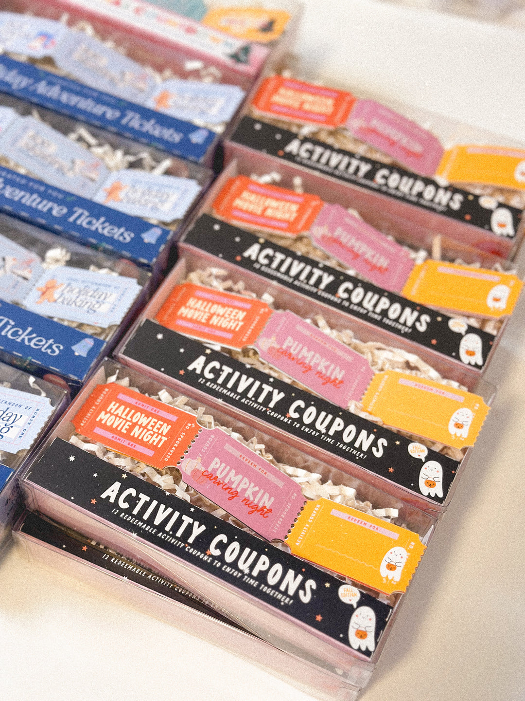 Packaged activity coupons with various themes on a white surface
