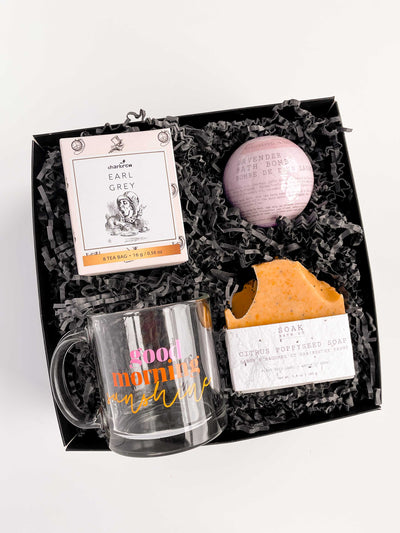 Bright and colorful spa gift box. Good morning sunshine mug, earl grey tea, bath bombs, and poppy seed soap. Bright, vibrant colors perfect for a modern gift for mothers day, a birthday, christmas, thank you gift, or any occasion . 