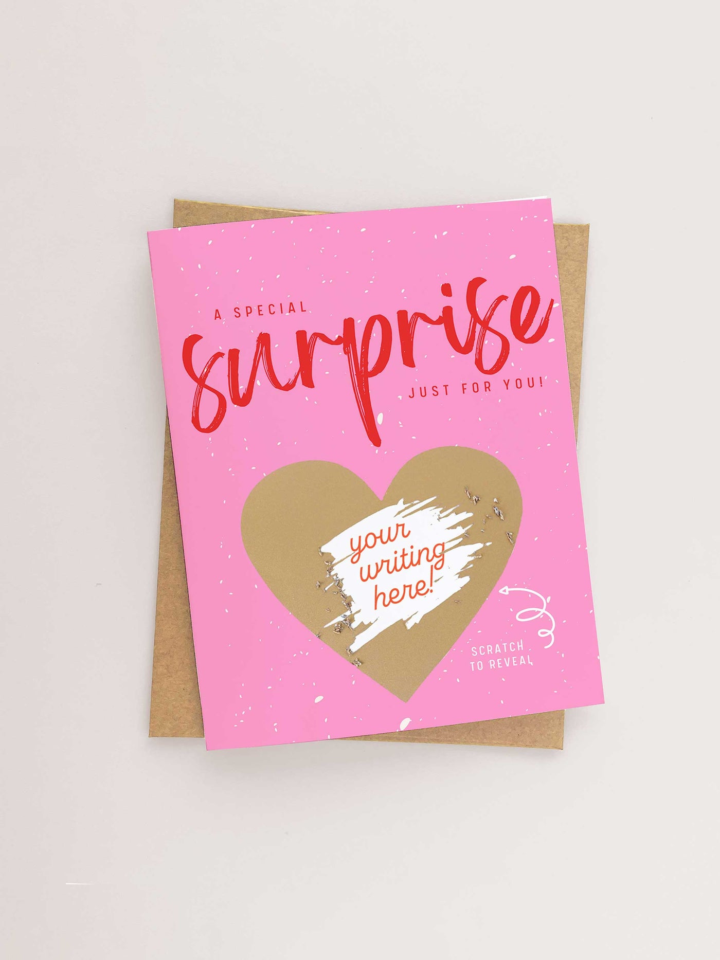 Scratch to reveal card. Bright Pink Card with a Gold Scratch off heart. Message a special surprise just for you